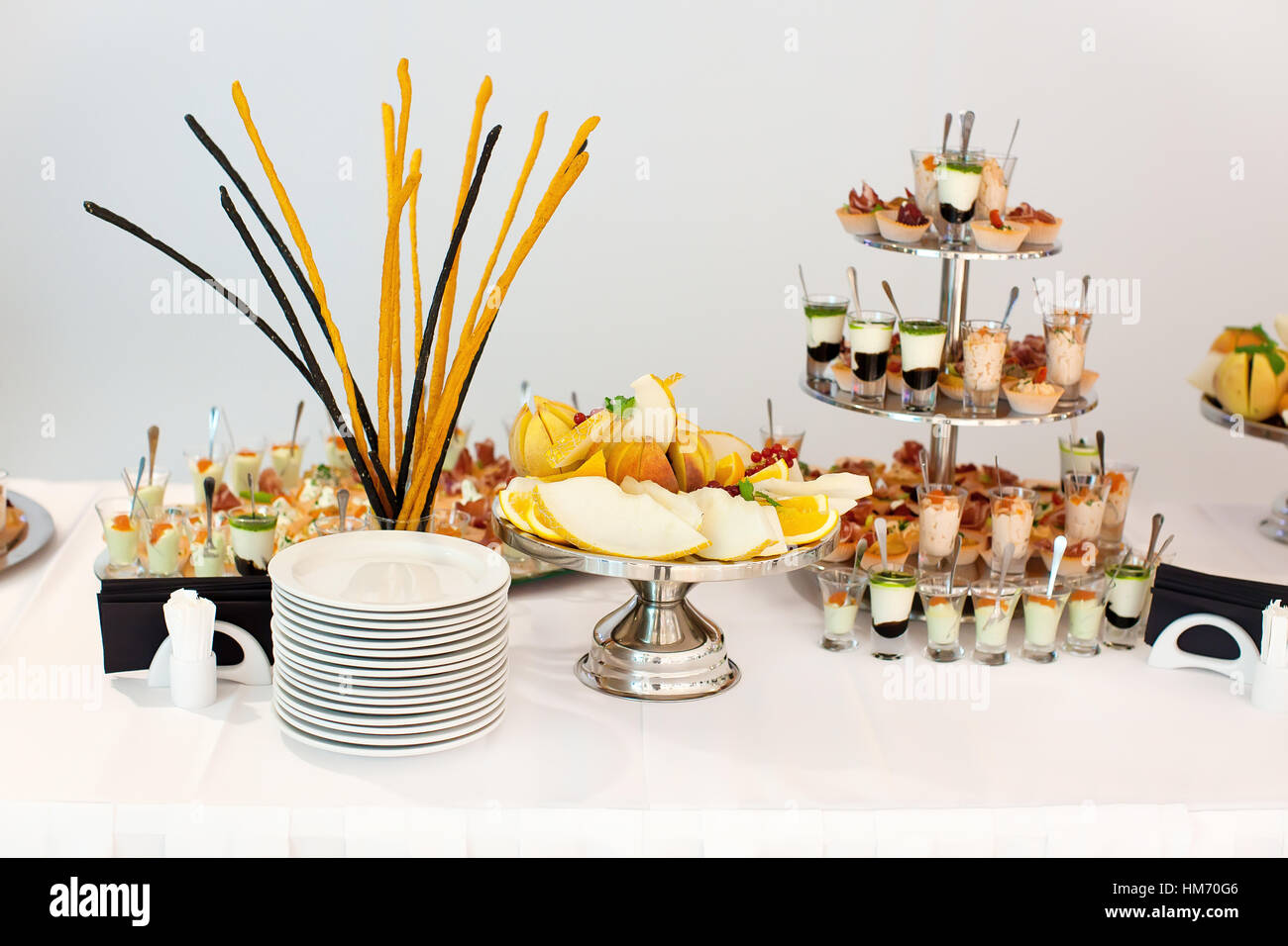 Table with different plates and snacks Stock Photo Alamy