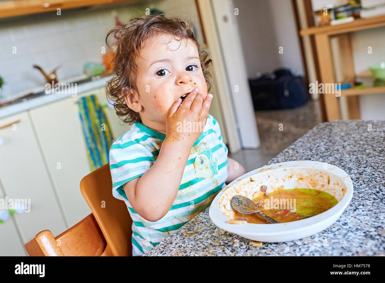 A sixteen months old baby girl learning to eat Stock Photo - Alamy