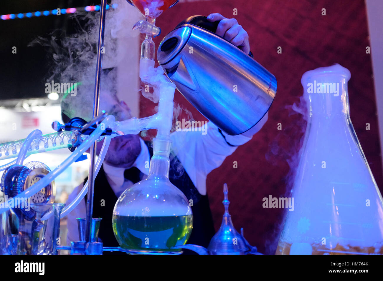 A barman preparing a molecular alcoholic cocktail using the equipment and techniques of molecular gastronomy in a bar in the city of Tel Aviv in Israel.  Known as molecular mixology, the method takes scientific principles and tools and applies them to the construction of alcoholic beverages. These cocktails often require their creator to freeze, gel or flambé ingredients. Stock Photo