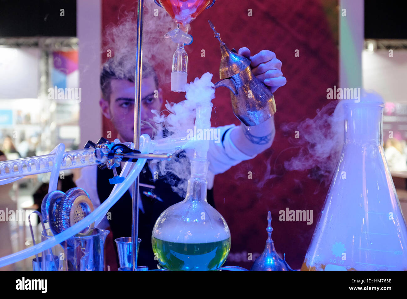A barman preparing a molecular alcoholic cocktail using the equipment and  techniques of molecular gastronomy in a bar in the city of Tel Aviv in  Israel. Known as molecular mixology, the method