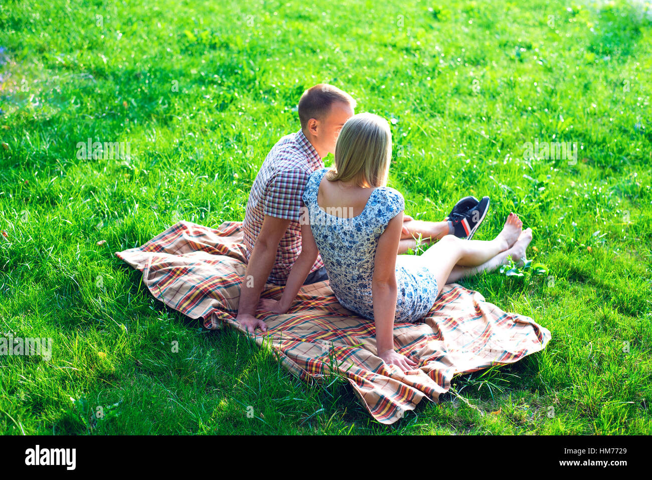Young Couple Man And Woman Sitting On Bench Hugging In Park Ribbon A