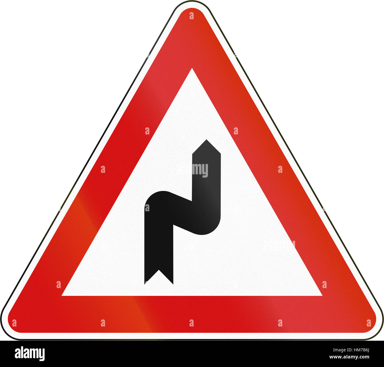 Slovenia road sign - Double bend, first to right. Stock Photo