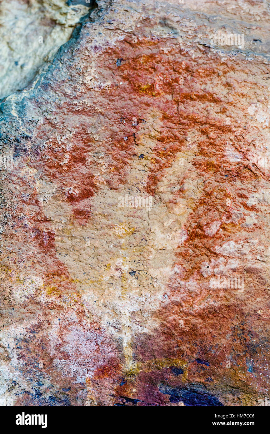 An ancient image of a human hand stencil painted in an Aboriginal rock art gallery. Stock Photo