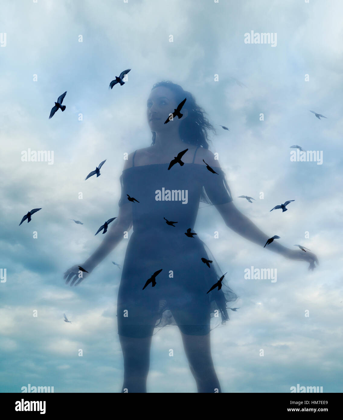 Multiple layered image of young woman against sky Stock Photo