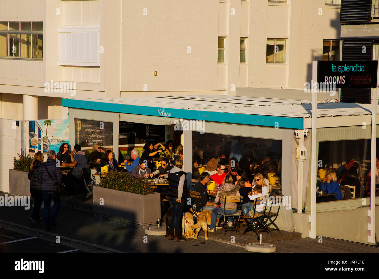 People enjoying the late afternoon at a restaurant, Sea Point, Cape Town, South Africa Stock Photo
