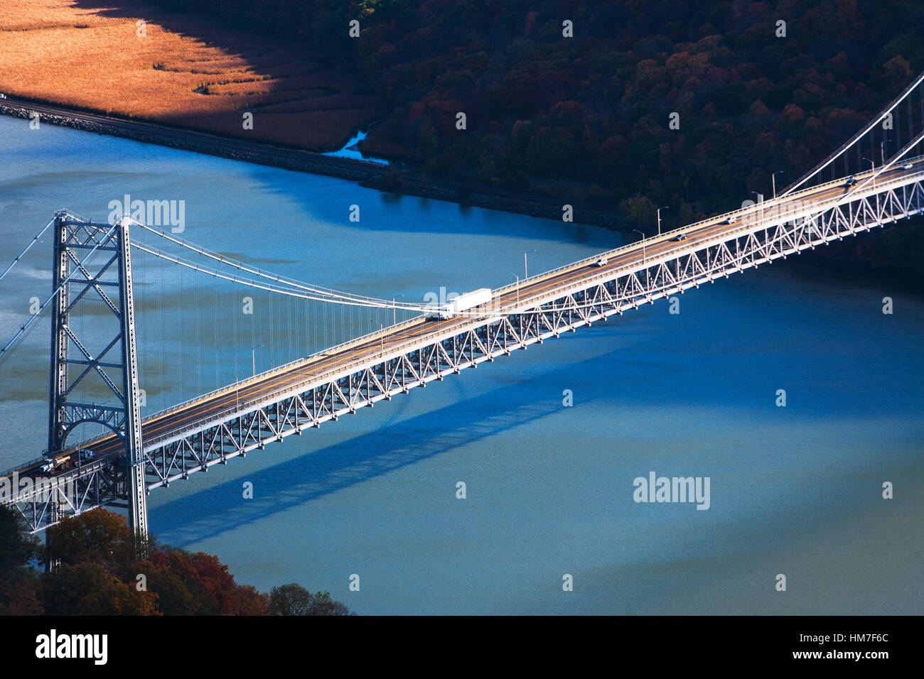 USA, New York, Bear Mountain with bridge above blue river Stock Photo