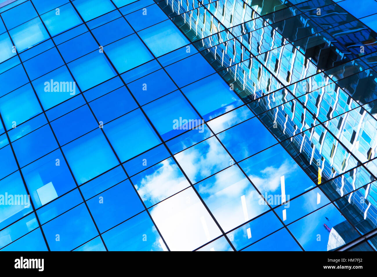 USA, New York, Clouds reflecting in glassy office building Stock Photo