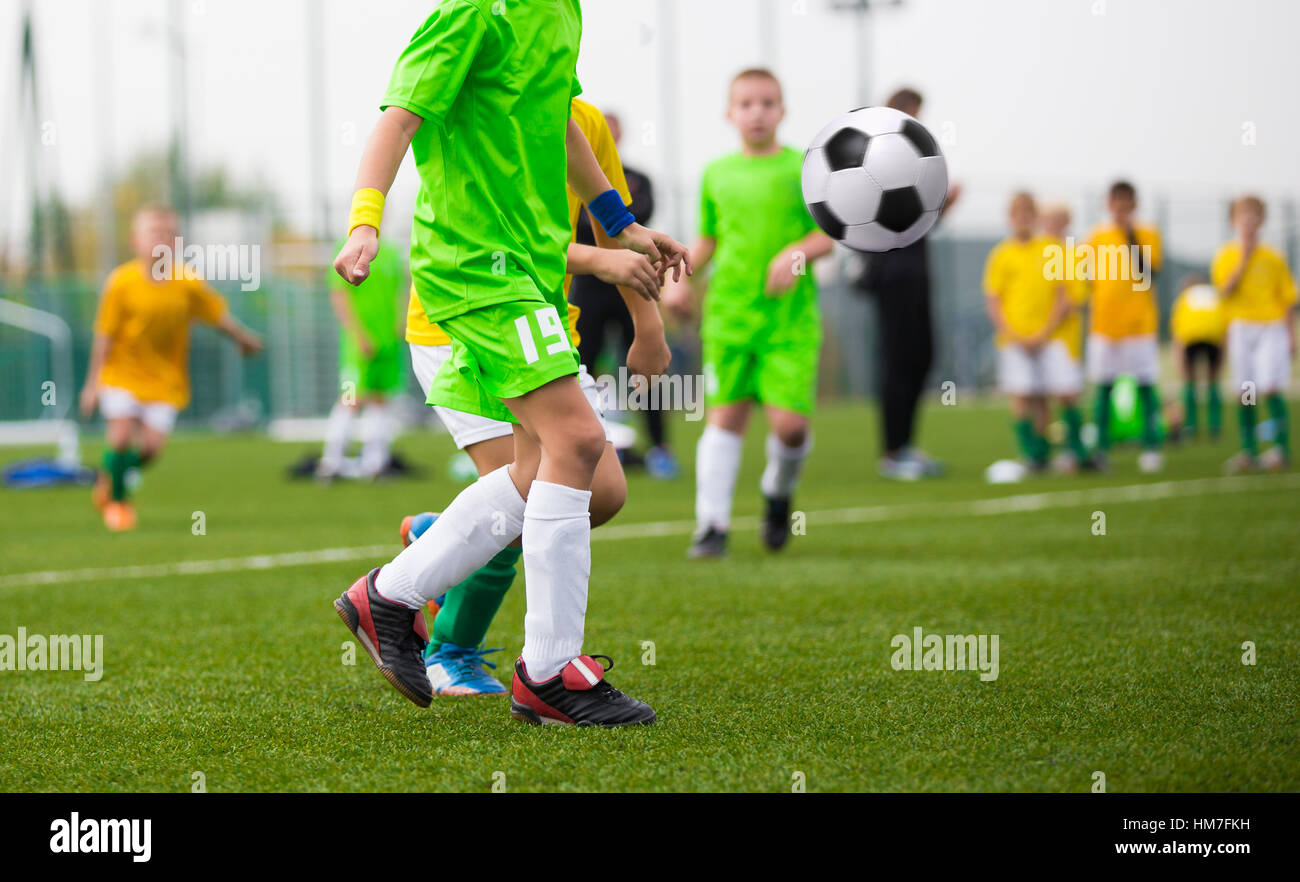 Children kicking soccer ball Stock Photo Alamy