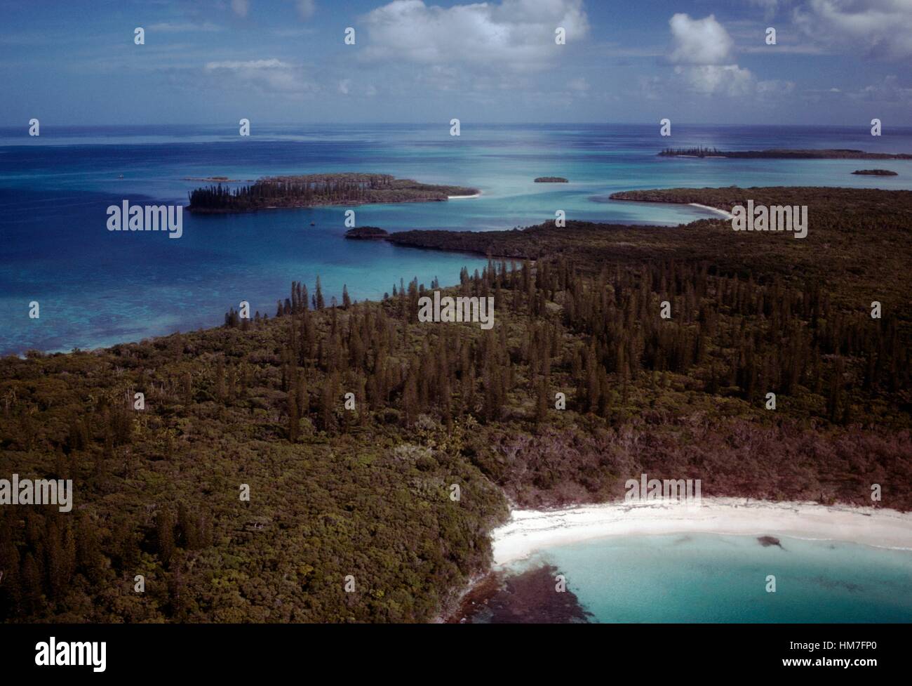 White sandy cove surrounded by vegetation, Isle of Pines, New Caledonia, Overseas territory of the French Republic. Stock Photo