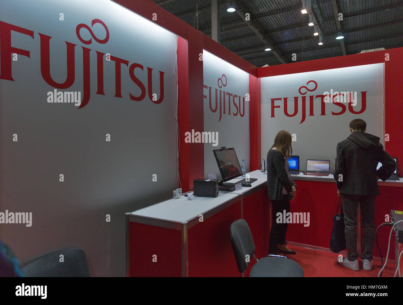 KIEV, UKRAINE - OCTOBER 11, 2015: People visit Fujitsu, Japanese information technology company booth during CEE 2015, the largest electronics trade s Stock Photo