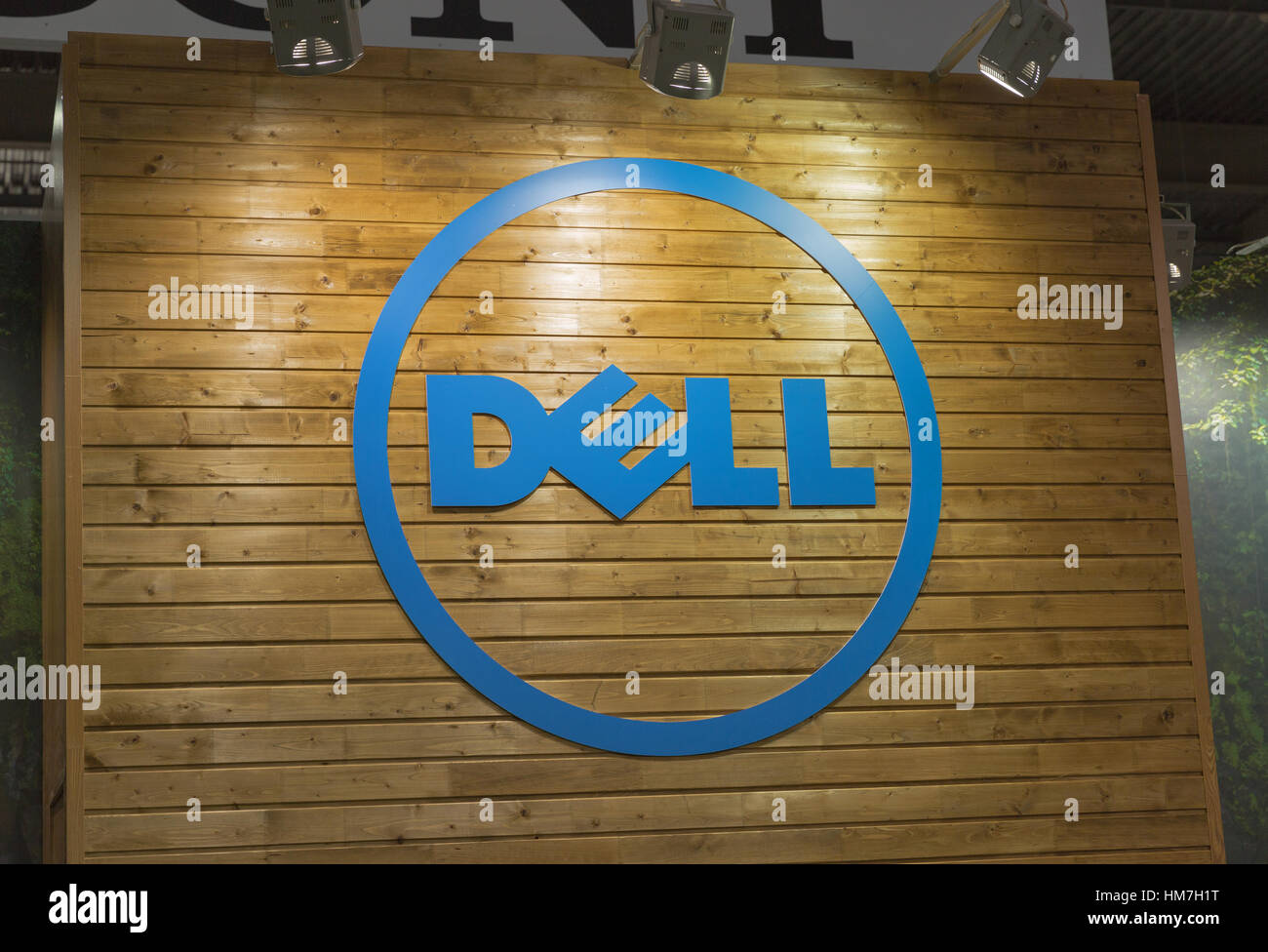 KIEV, UKRAINE - OCTOBER 11, 2015:  Dell logo on a wooden base illuminated by searchlights on company booth during CEE 2015, largest electronics trade  Stock Photo