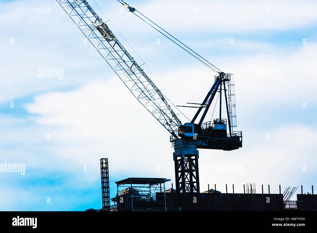Crane at construction site against sky Stock Photo