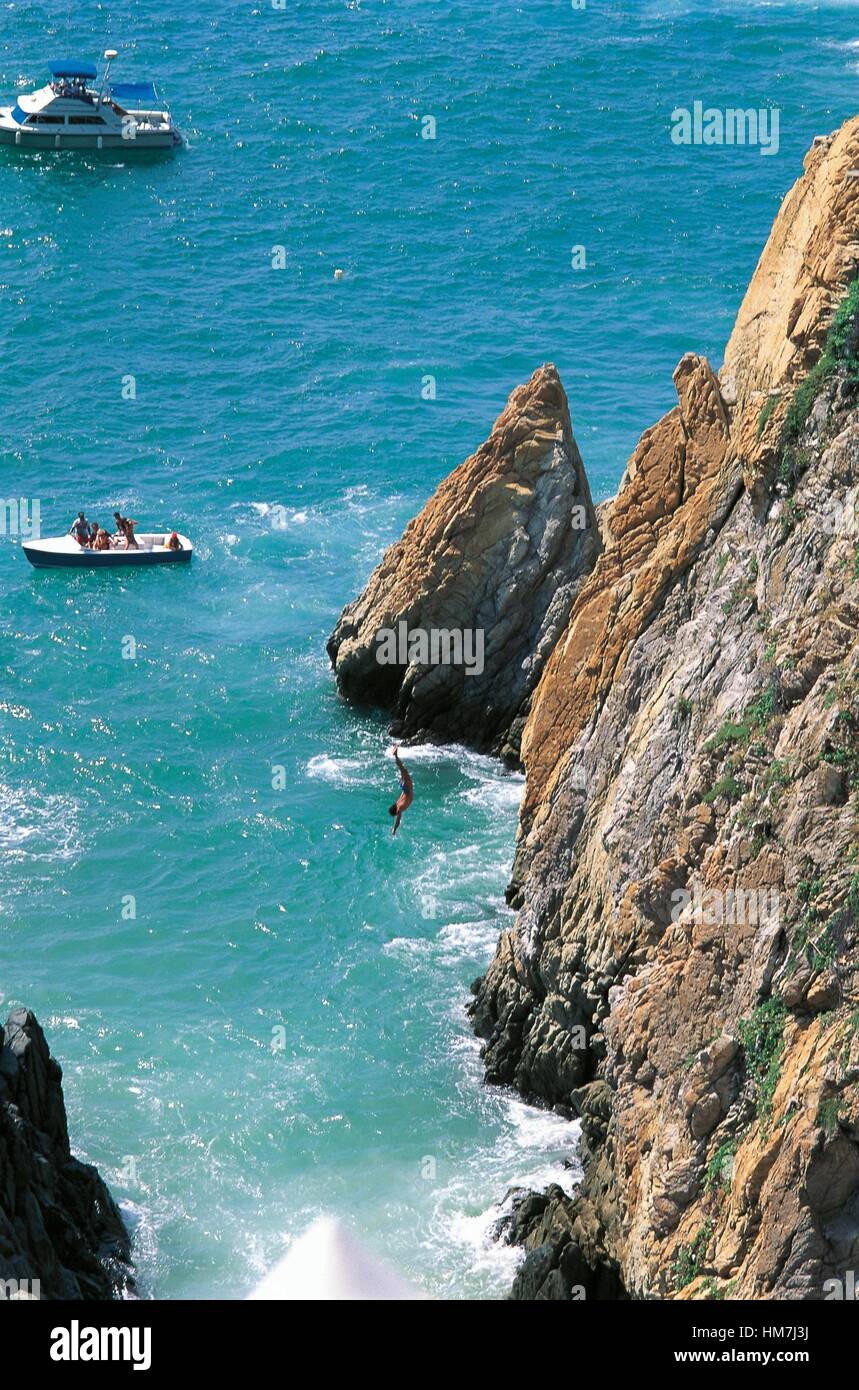 A diver diving from the La Quebrada cliff, Acapulco, State of Guerrero, Mexico. Stock Photo