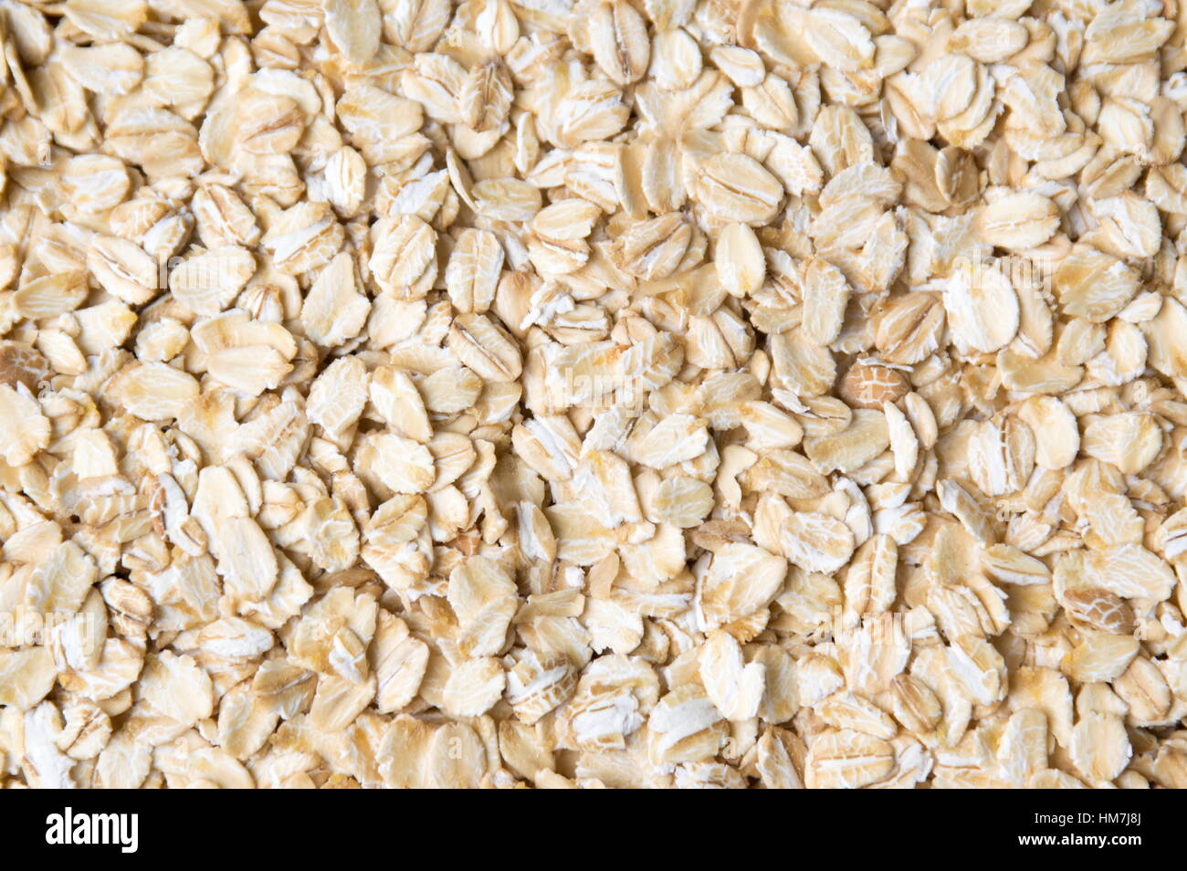 Bunch of oat flakes forming a background pattern Stock Photo