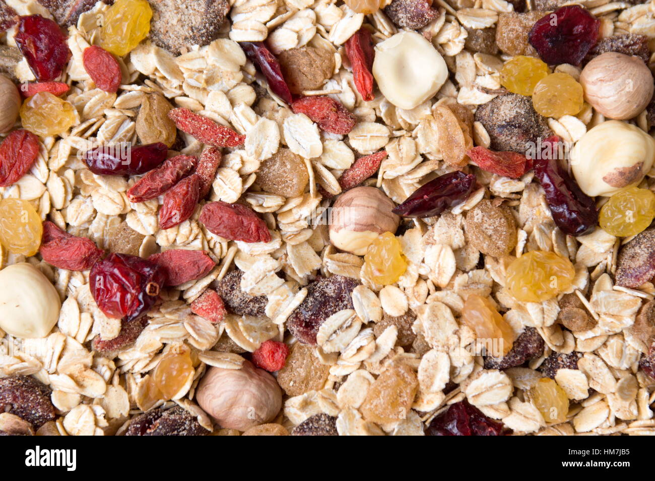 Oat flakes and dried fruit background pattern Stock Photo