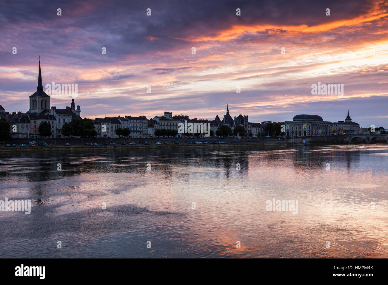 France, Pays de la Loire, Saumur, City waterfront at sunset Stock Photo