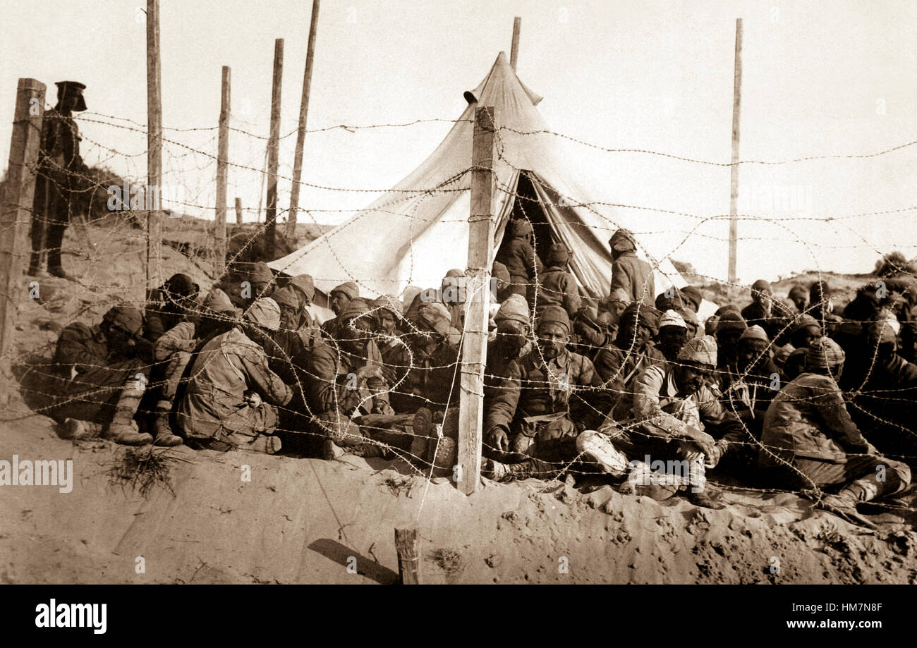 Turkish prisoners behind their own barbed wire at Seddul Bahr. Ca. 1915 Dardanelles Campaign.  British Official. (War Dept.) Exact Date Shot Unknown Stock Photo