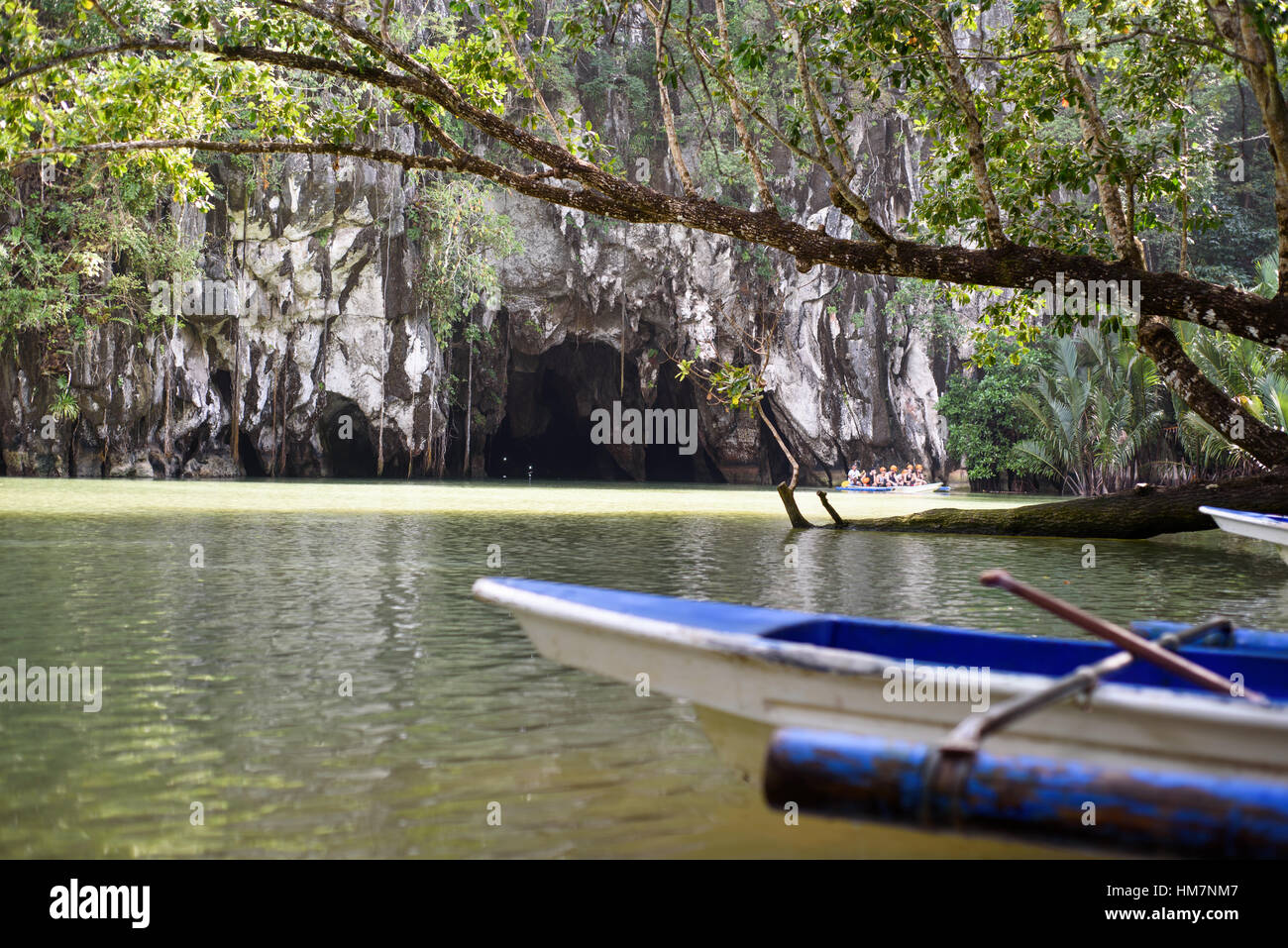 Blue boat at the river bank Stock Photo - Alamy