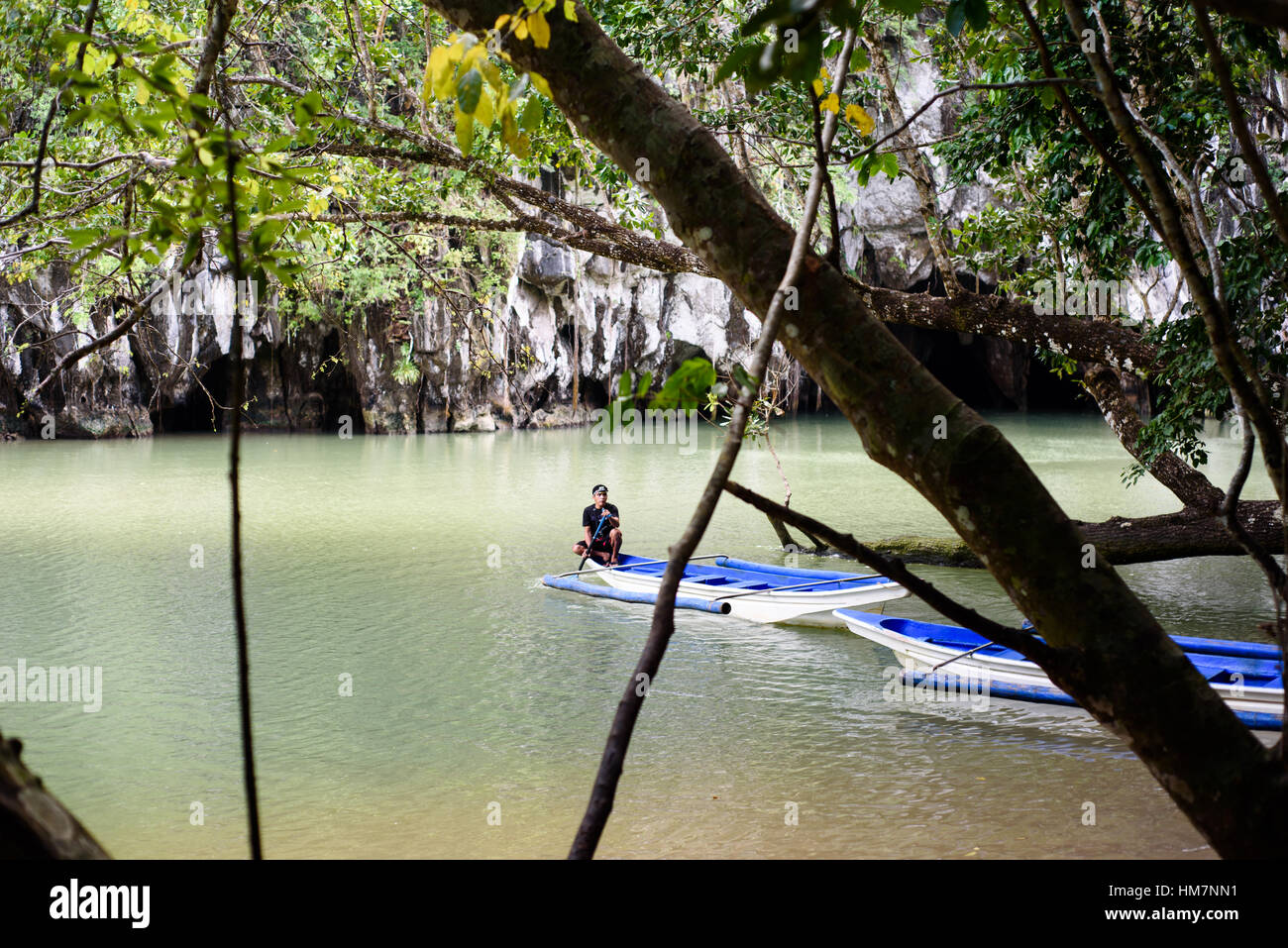 Blue boat at the river bank Stock Photo - Alamy