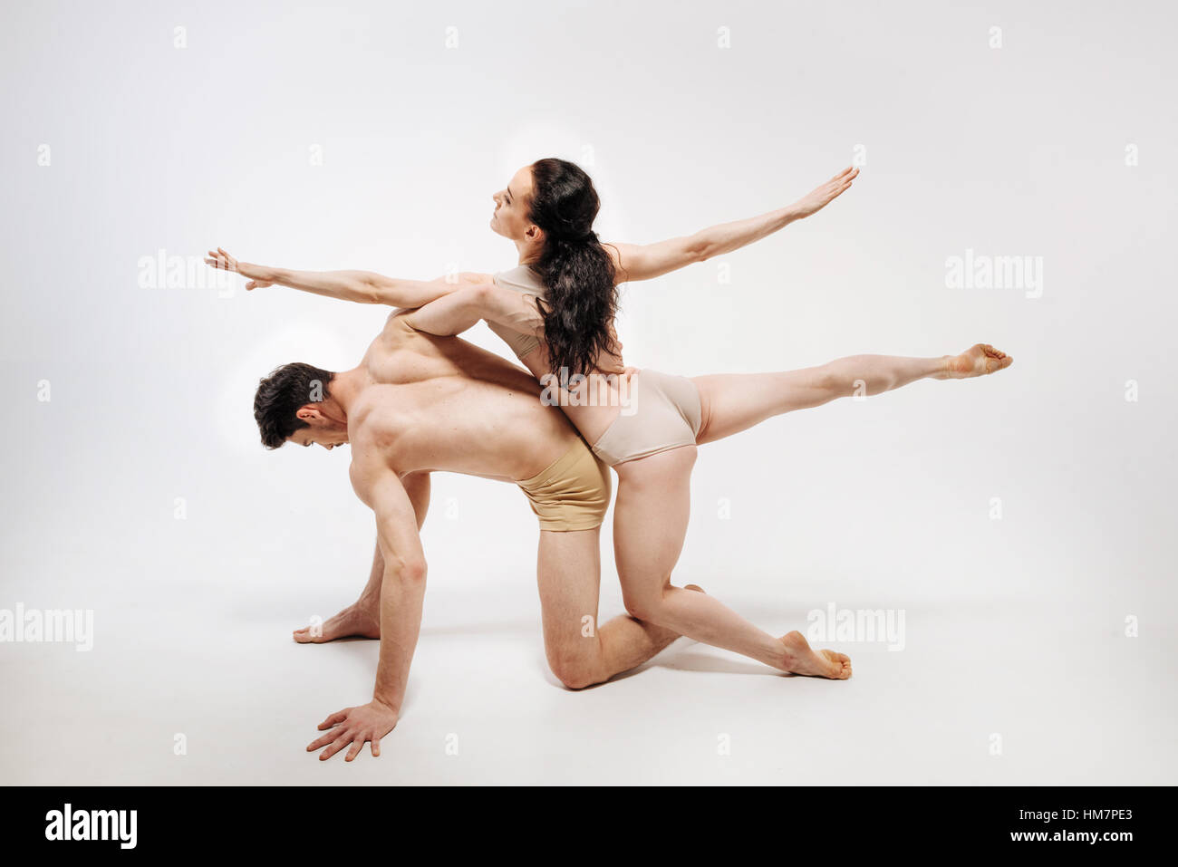 Steady slim ballet dancers posing in the studio Stock Photo