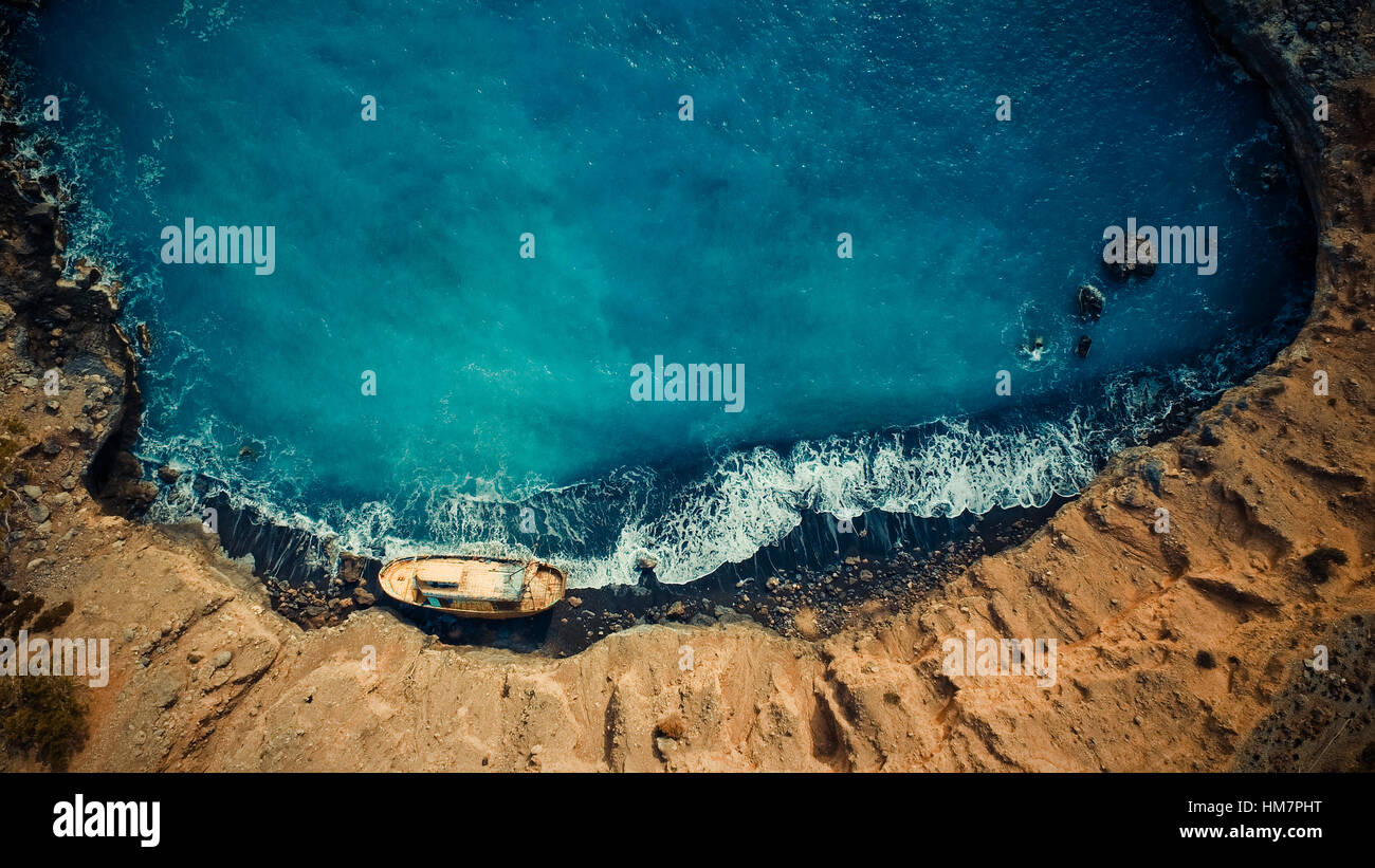 A ship on the shore of a beauytiful greek beach. This was shot on the south coast of Crete Stock Photo