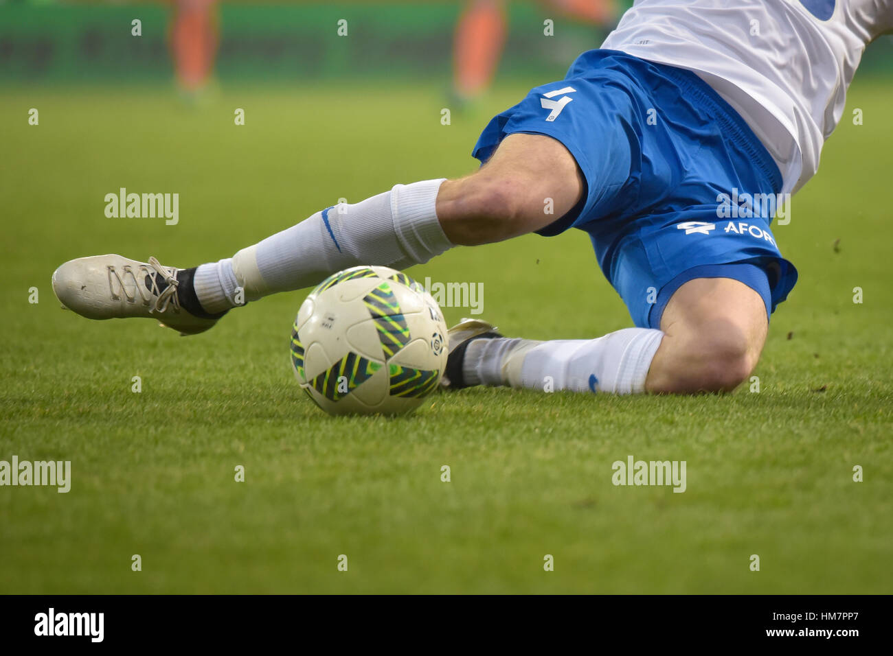 LUBIN, POLAND - NOVEMBER 25, 2016: Match Polish Premier League Lotto Ekstraklasa between KGHM Zaglebie Lubin - Lech Poznan 0:3. Slide tackle player's  Stock Photo