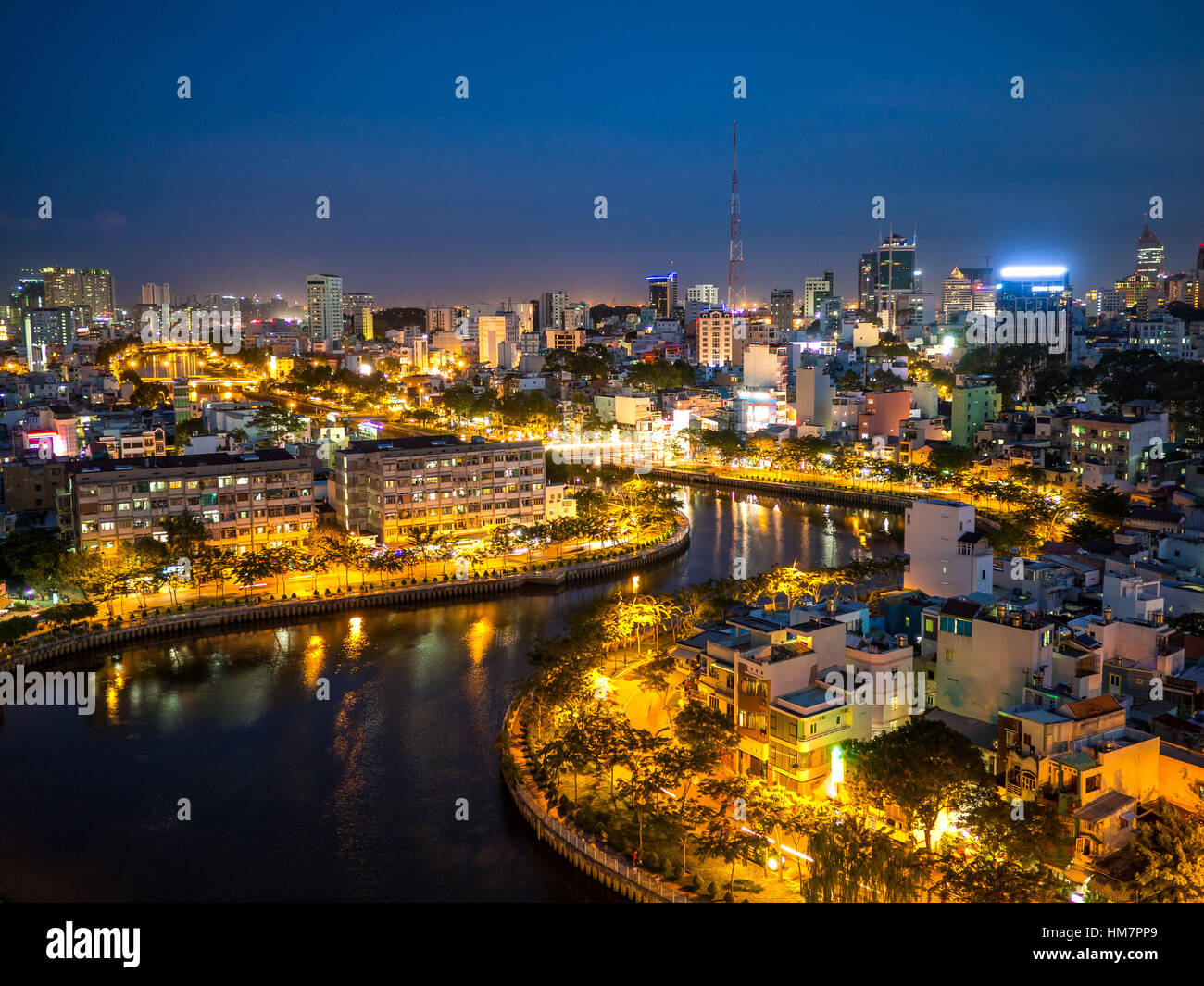 Aerial citynight view of rooftop skyscraper on Nhieu Loc canal in Ho ...