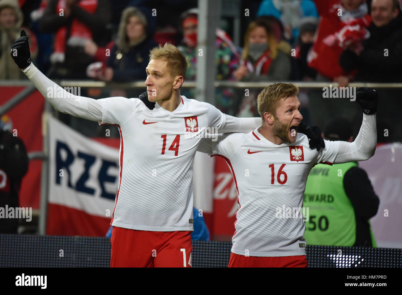 WROCLAW, POLAND - NOVEMBER 14, 2016: Friendly football match Poland -  Slowenia 1:1. Lukasz Teodorczyk (L) and Jakub Blaszczykowski after shotting goa Stock Photo