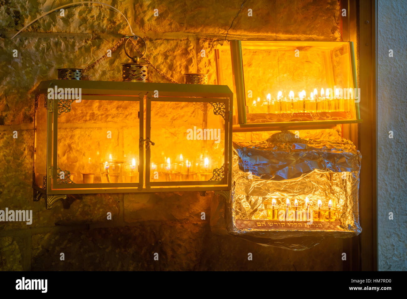 Traditional Menorahs (Hanukkah Lamps) with olive oil candles, in the