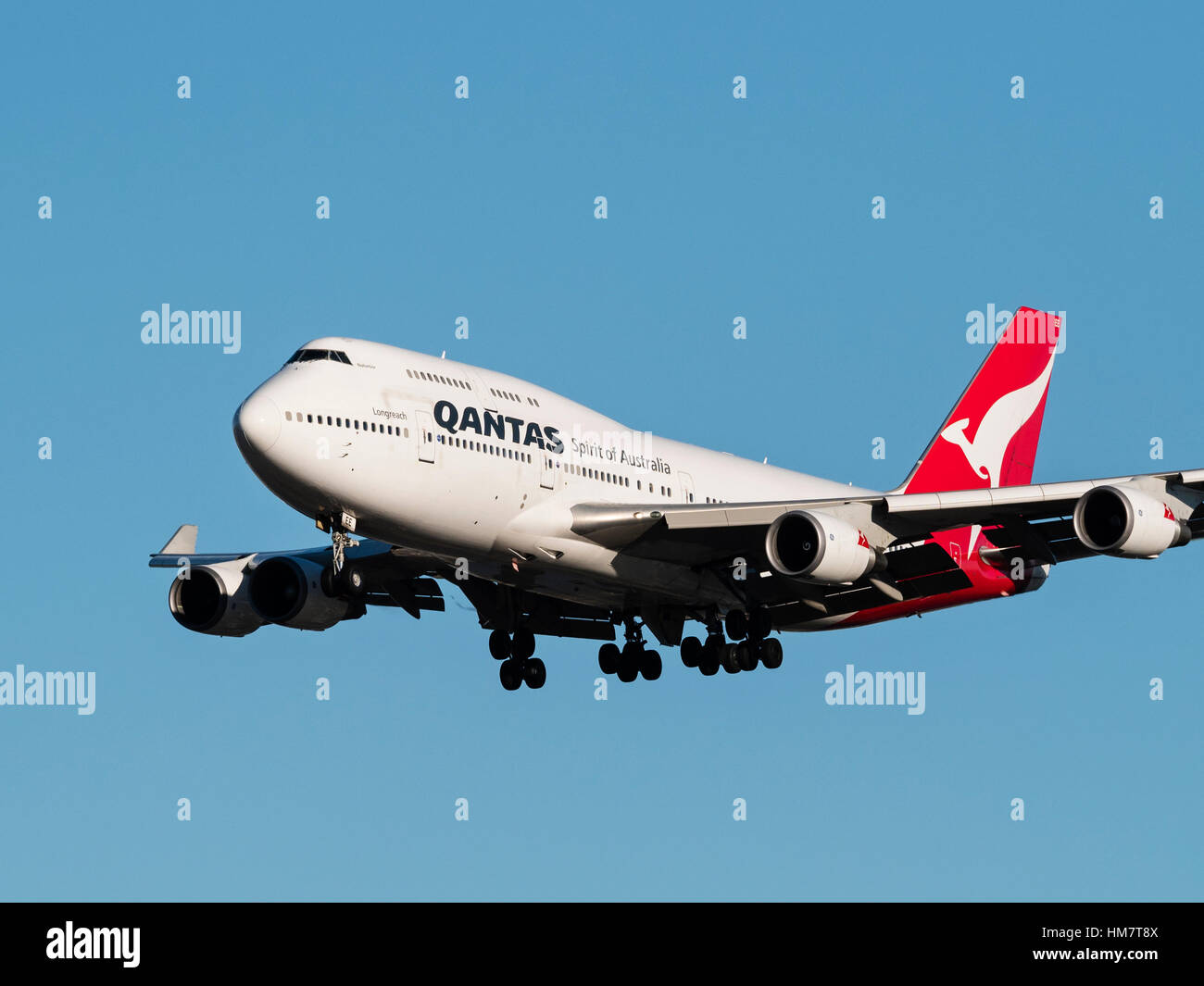 Qantas plane airplane Boeing 747 (747-438ER) wide-body jumbo jet airliner  final approach landing Vancouver International Airport Stock Photo
