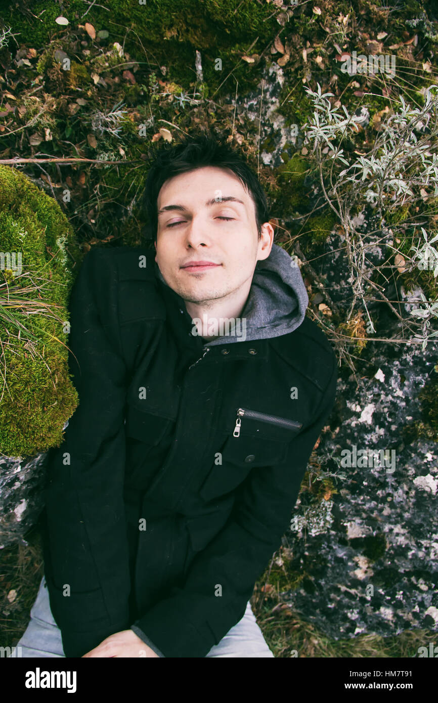 Young man in nature outdoors green hi-res stock photography and images ...