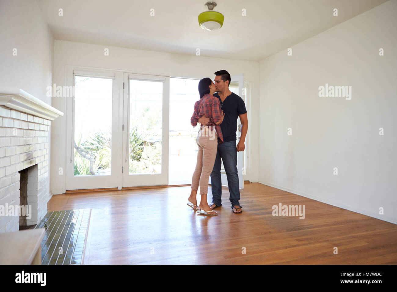 Romantic Couple In New Home On Moving Day Stock Photo - Alamy