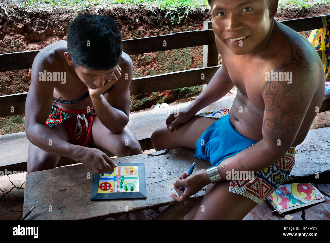 Playing Parcheesi in the village of the Native Indian Embera Tribe, Embera Village, Panama. Panama Embera people Indian Village Indigenous Indio indio Stock Photo