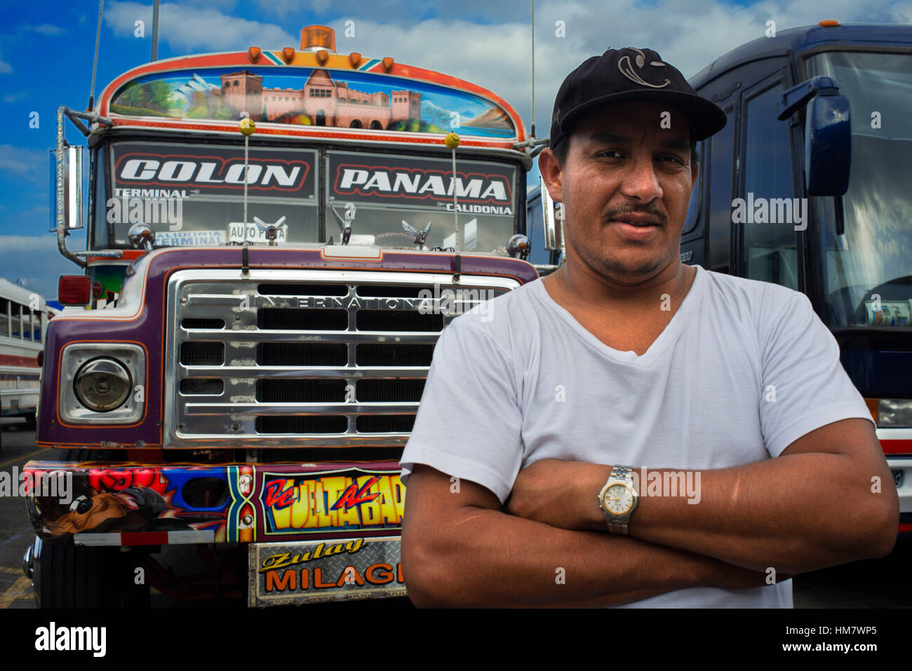 Driver of BUS RED DEVIL DIABLO ROJO PAINTED BUS PANAMA CITY REPUBLIC OF PANAMA. Albrok bus station terminal. Panama. Here comes the Diablo Rojo, the R Stock Photo
