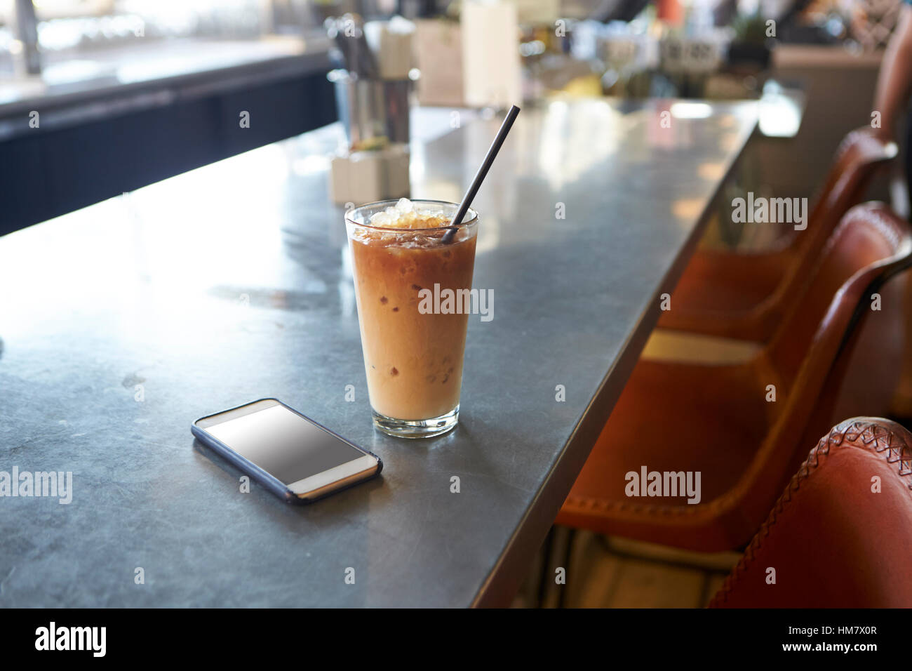 Mobile Phone And Cold Press Coffee On Cafe Counter Stock Photo Alamy