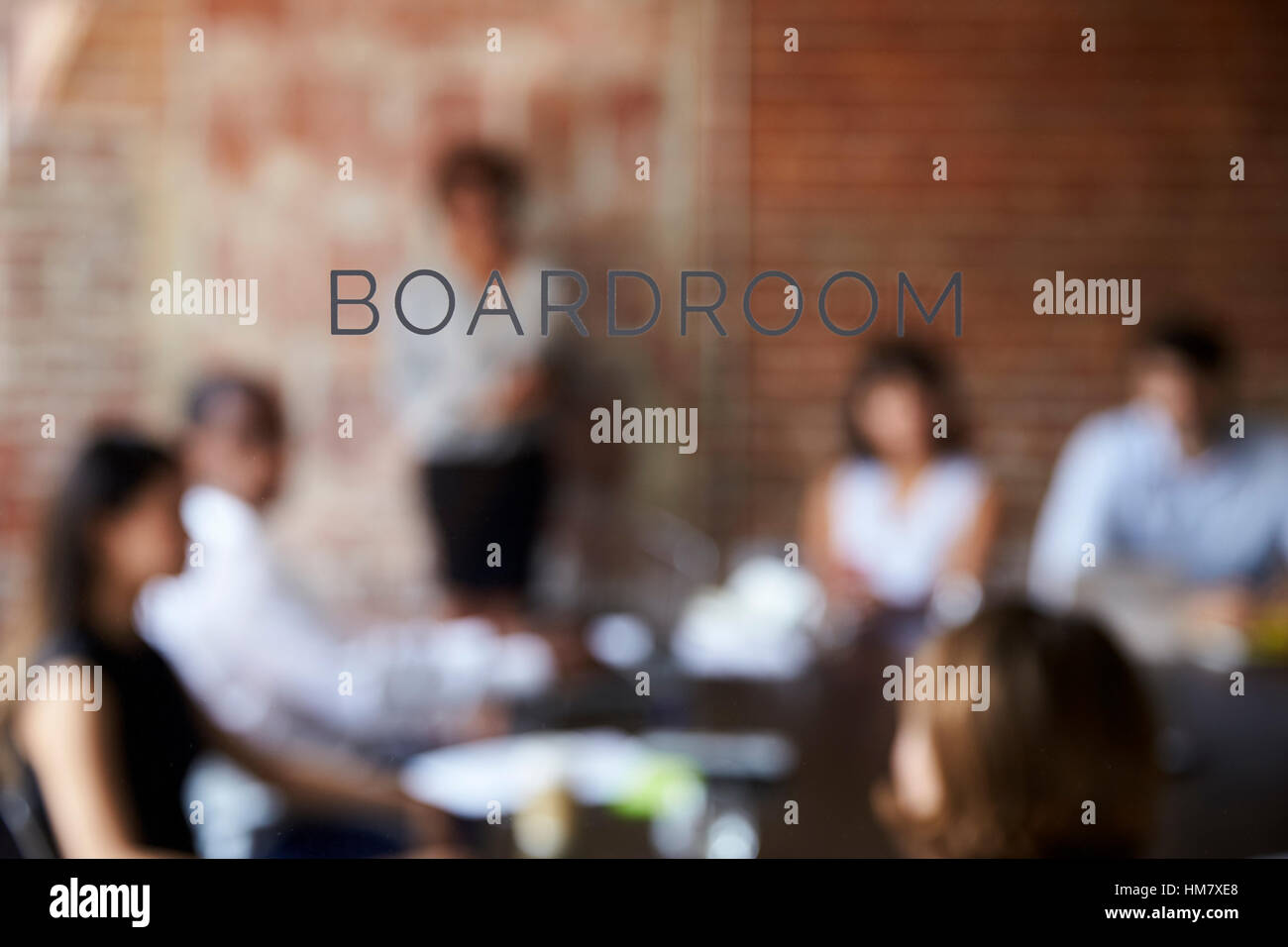View Of Meeting Through Glass Door Labelled Boardroom Stock Photo