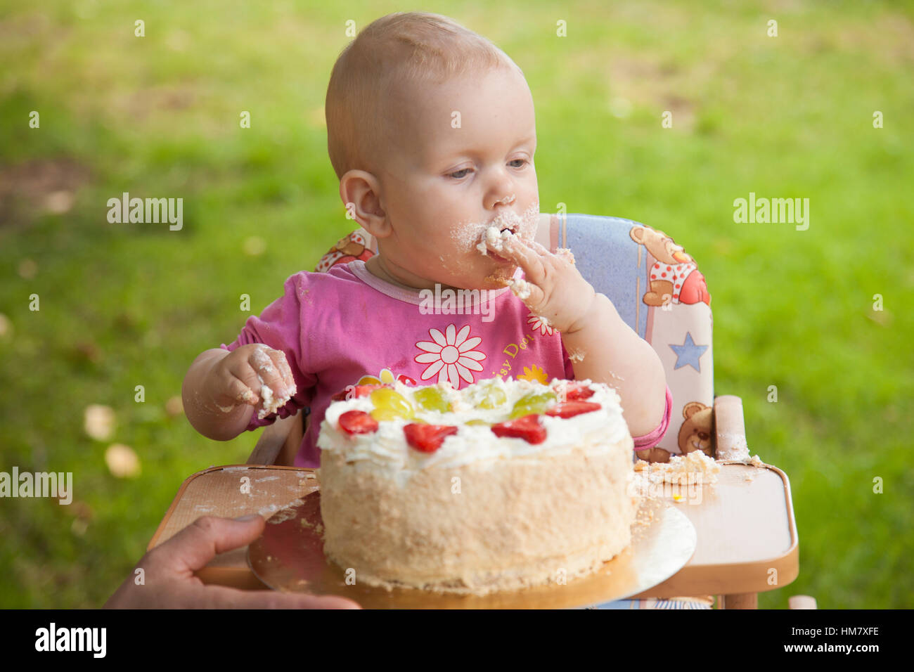 baby eating cake