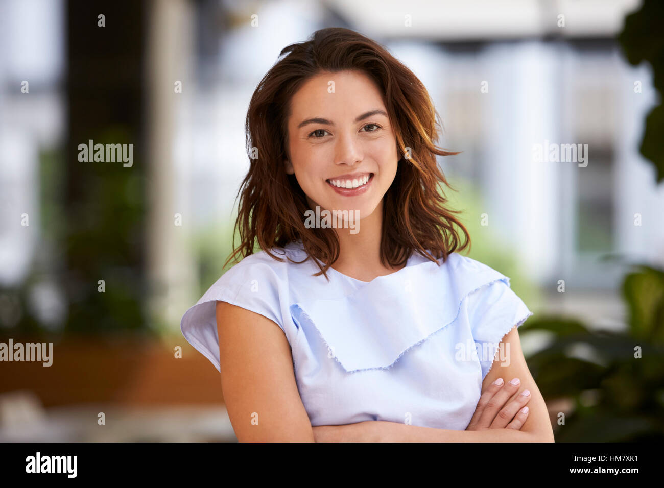 Close up of young mixed race businesswoman looking at camera Stock Photo