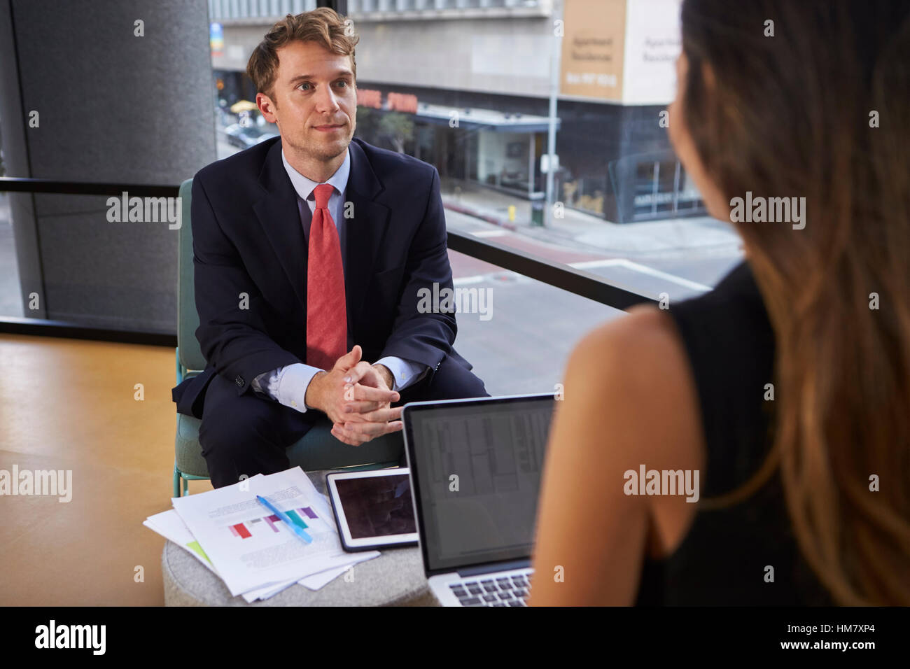 Young businessman and woman at an informal meeting in office Stock ...