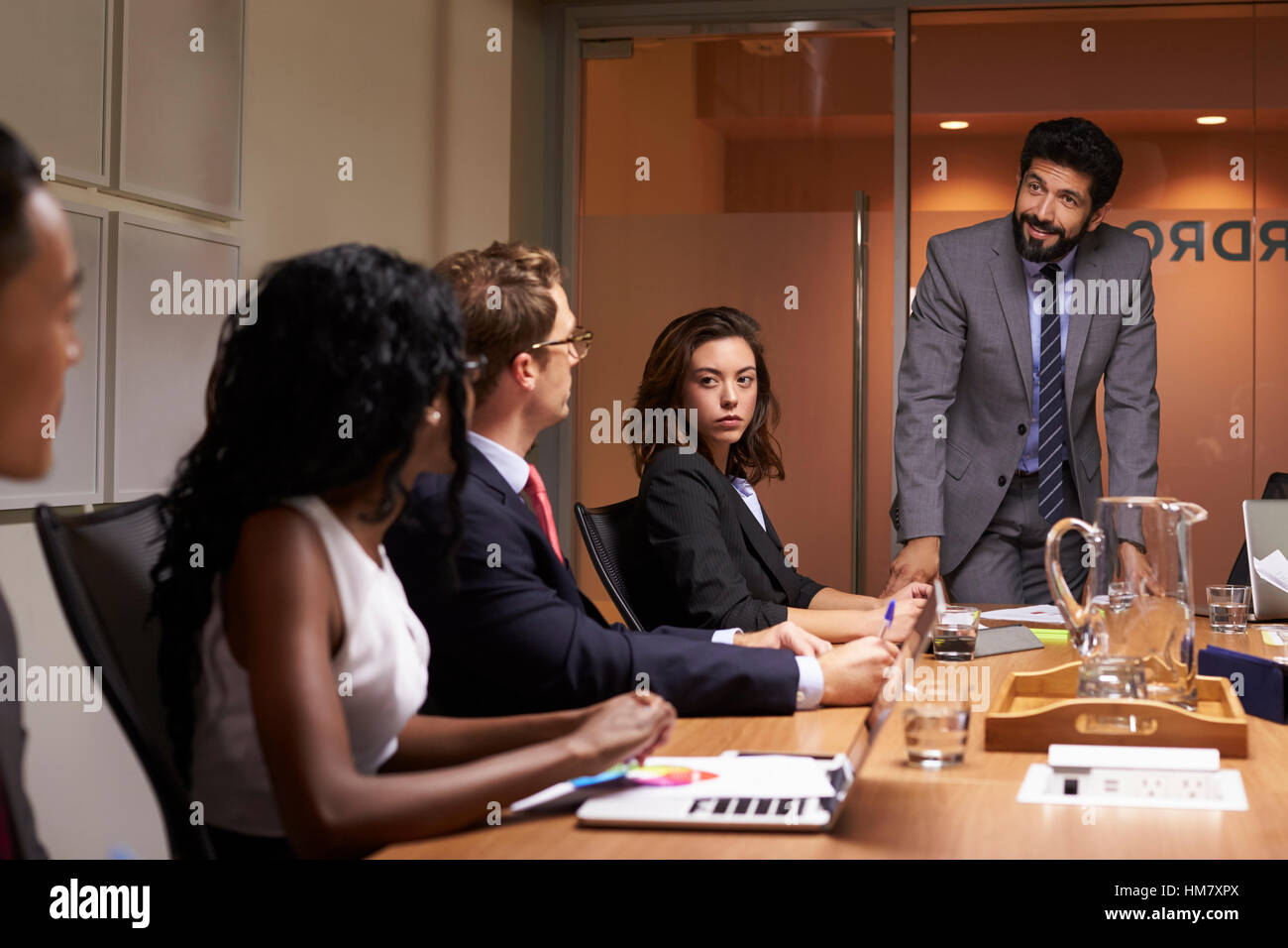 Businessman addressing colleagues at a meeting, close up Stock Photo