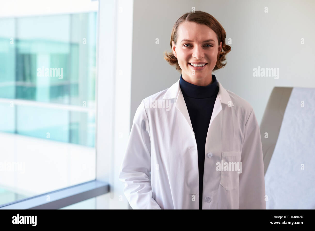View doctor wearing white coat hi-res stock photography and images - Alamy