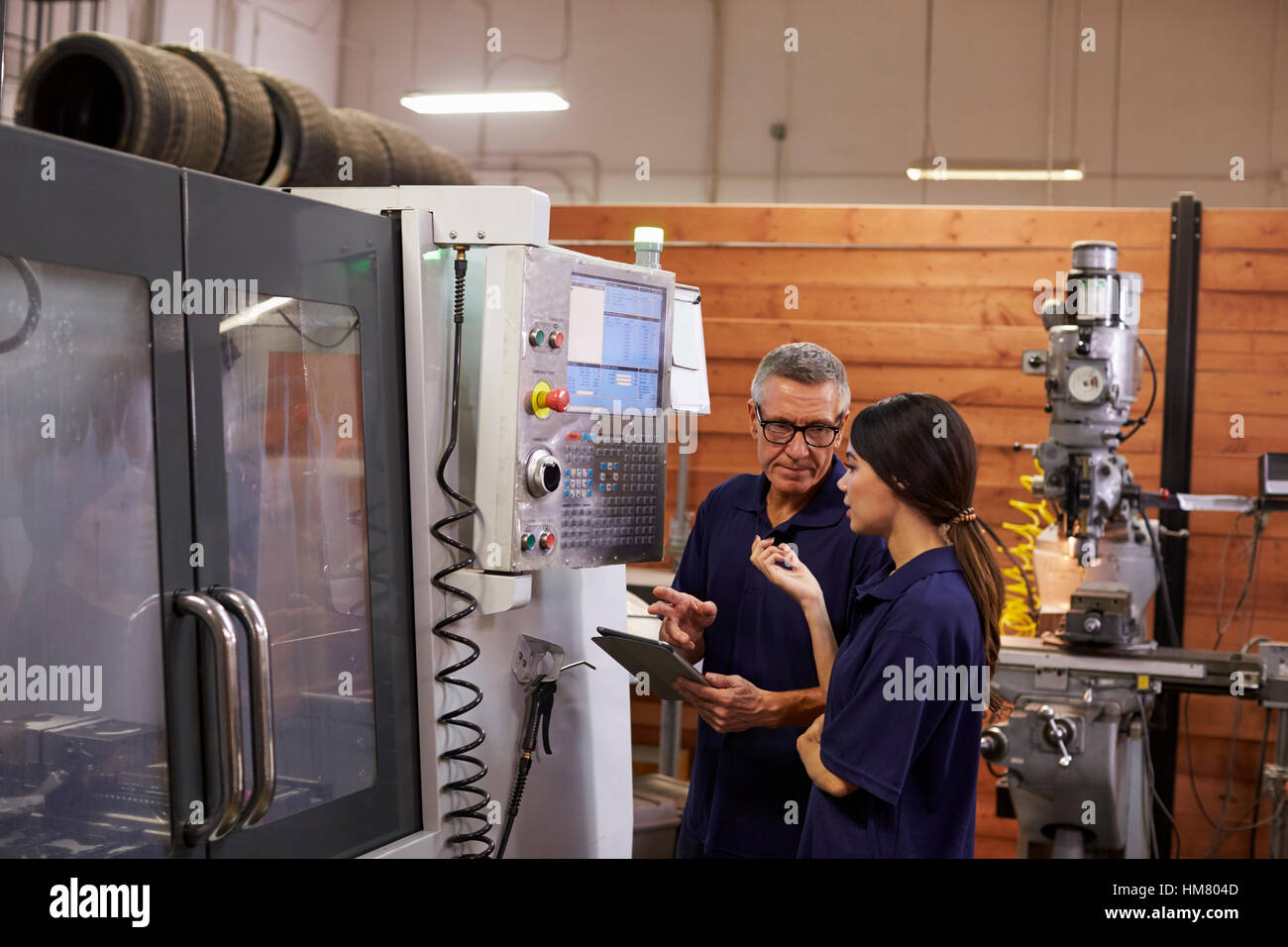 Female machine worker hi-res stock photography and images - Alamy