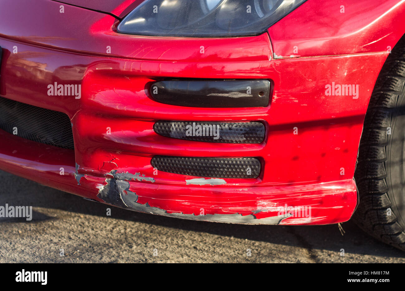 broken car bumper of lowered suspension red sport car Stock Photo Alamy
