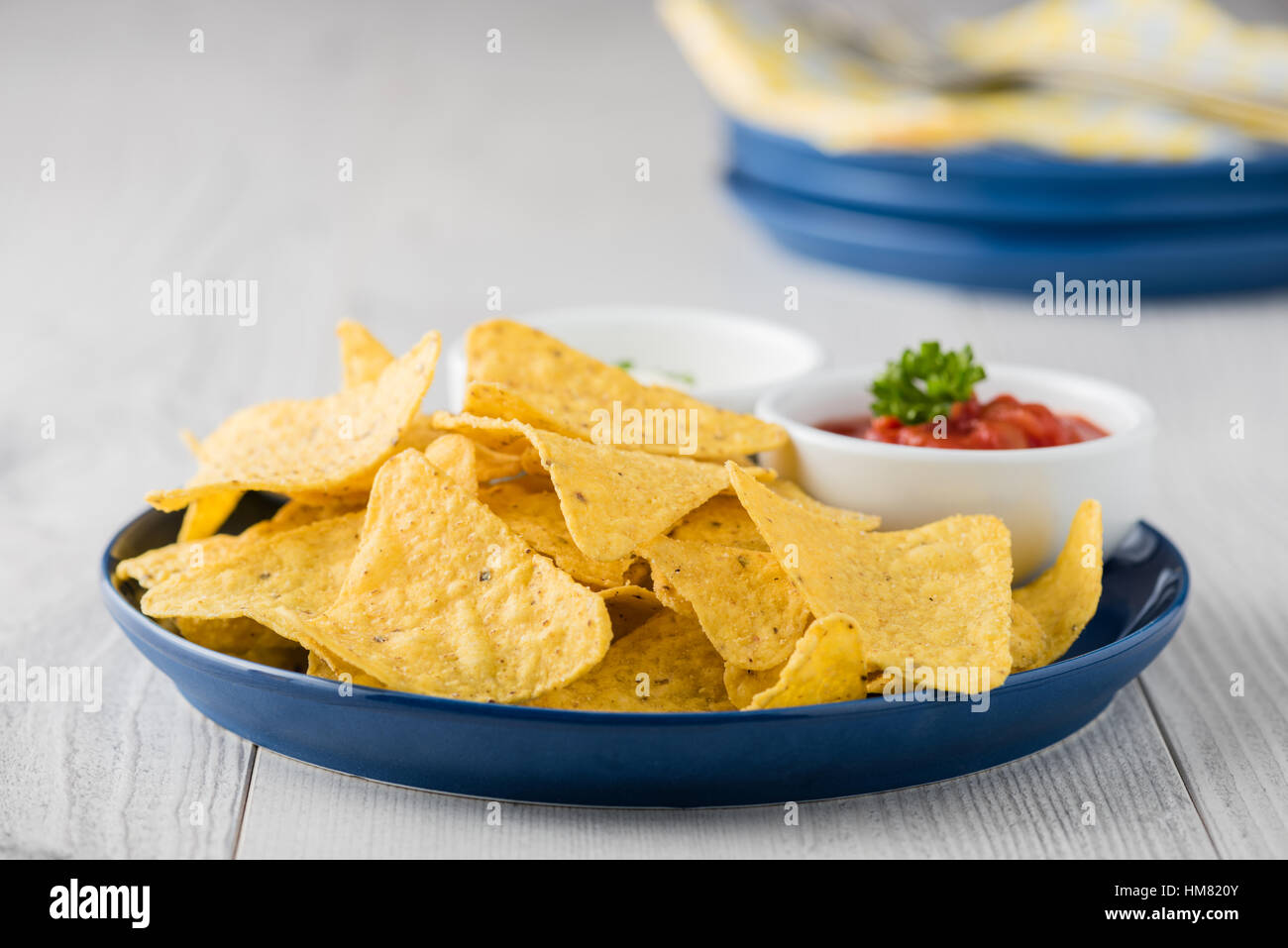 Nachos with salsa and sour cream dips Stock Photo Alamy