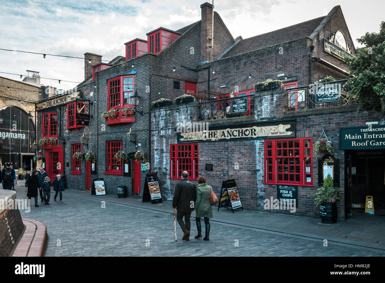 London, United Kingdom - October 18, 2016: People are walking near the Anchor Bankside which is a pub in the London Borough of Southwark. Stock Photo