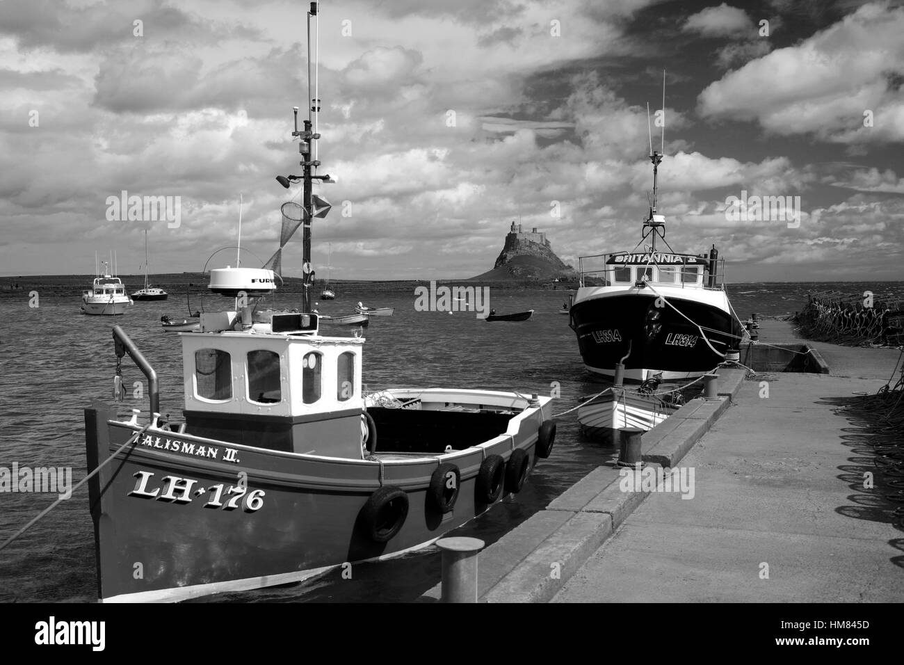Fishing Boats in the Harbour, with Lindisfarne Castle, Holy Island Lindisfarne, North Northumberland Coast, Area of Outstanding Natural Beauty, Herita Stock Photo