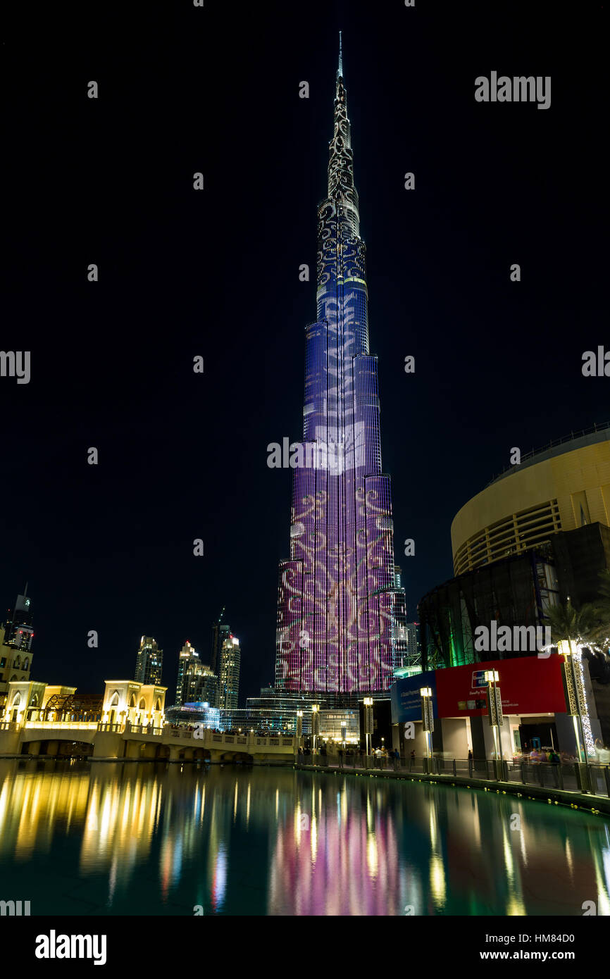 DUBAI, UAE - NOVEMBER 8, 2016: Burj Khalifa skyscraper is tallest in the world. Color projection on a building skyscraper Stock Photo