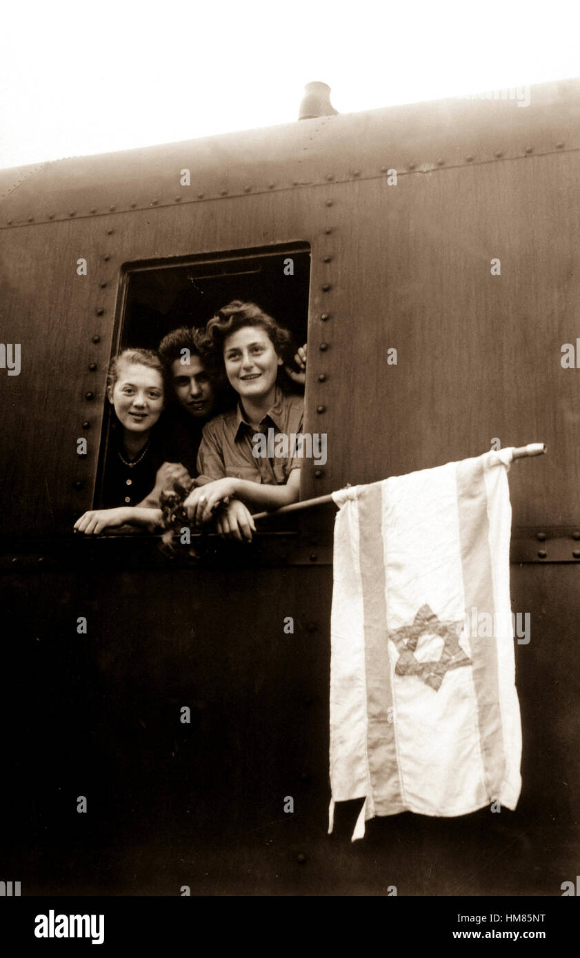 These Jewish children are on their way to Palestine after having been released from the Buchenwald Concentration Camp.  The girl on the left is from Poland, the boy in the center from Lativa, and the girl on right from Hungary.  June 5, 1945. T4c. J. E. Myers. (Army) Exact Date Shot Unknown NARA FILE #:  111-SC-207907 WAR & CONFLICT BOOK #:  1262 Stock Photo