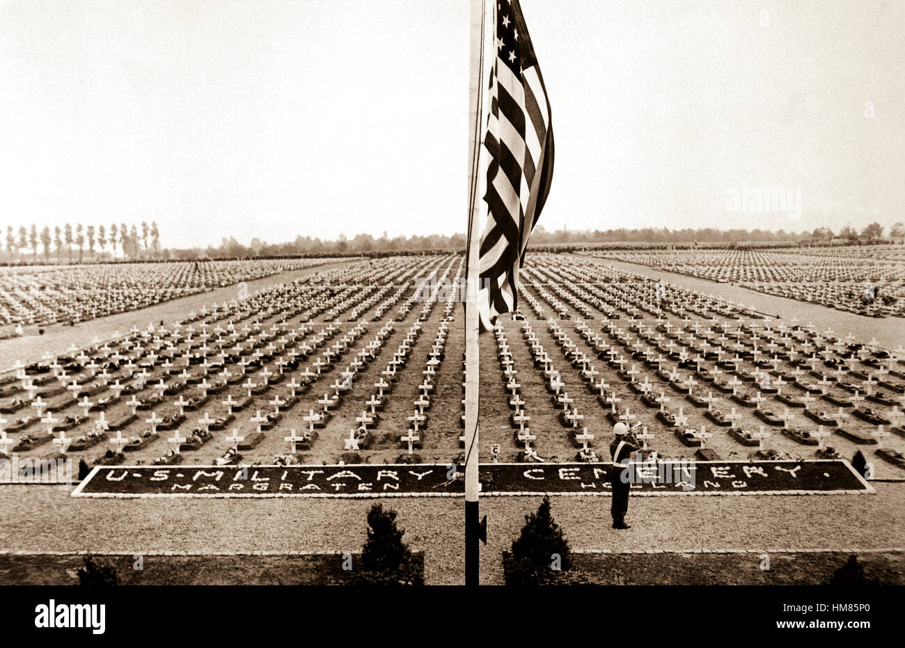 A bugler blow taps at the close of Memorial Day service at Margraten Cemetery, Holland, where lie thousands of American heroes of World War II.  May 30, 1945.  Pfc. Richard G. Thompson.  (Army) NARA FILE #:  111-SC-207902 WAR & CONFLICT BOOK #:  1348 Stock Photo