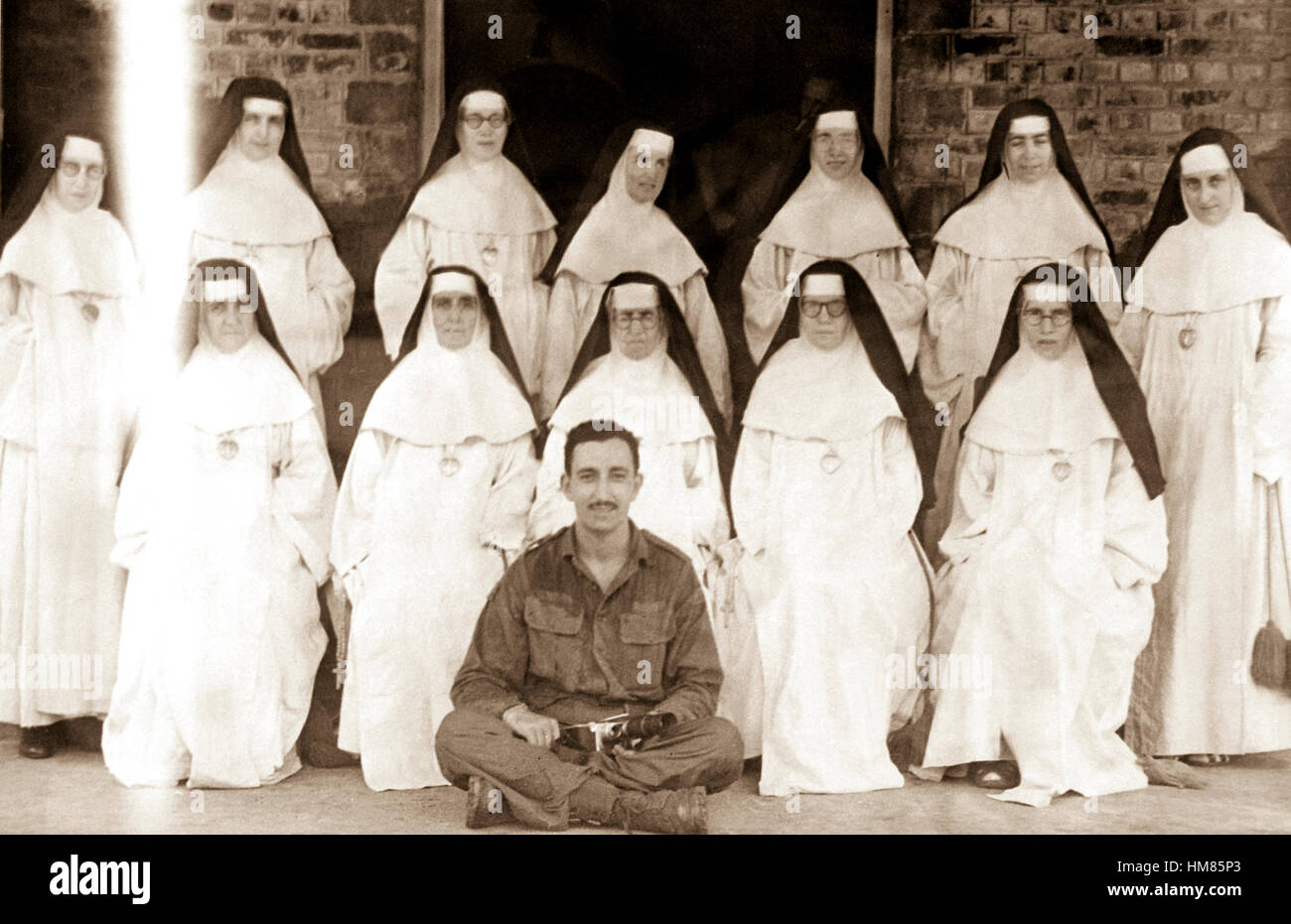 'The Fighting Irish', Good Shepherd Convent. Thirteen Irish nuns who had been interned in the Rangoon City Jail by the Japanese, but were later released as neutrals.  Burma, May 28, 1945.  Attributed to Cpl. Rodney C. Ferguson. (OSS) NARA FILE #:  226-FPK-15-1 WAR & CONFLICT BOOK #:  1270 Stock Photo